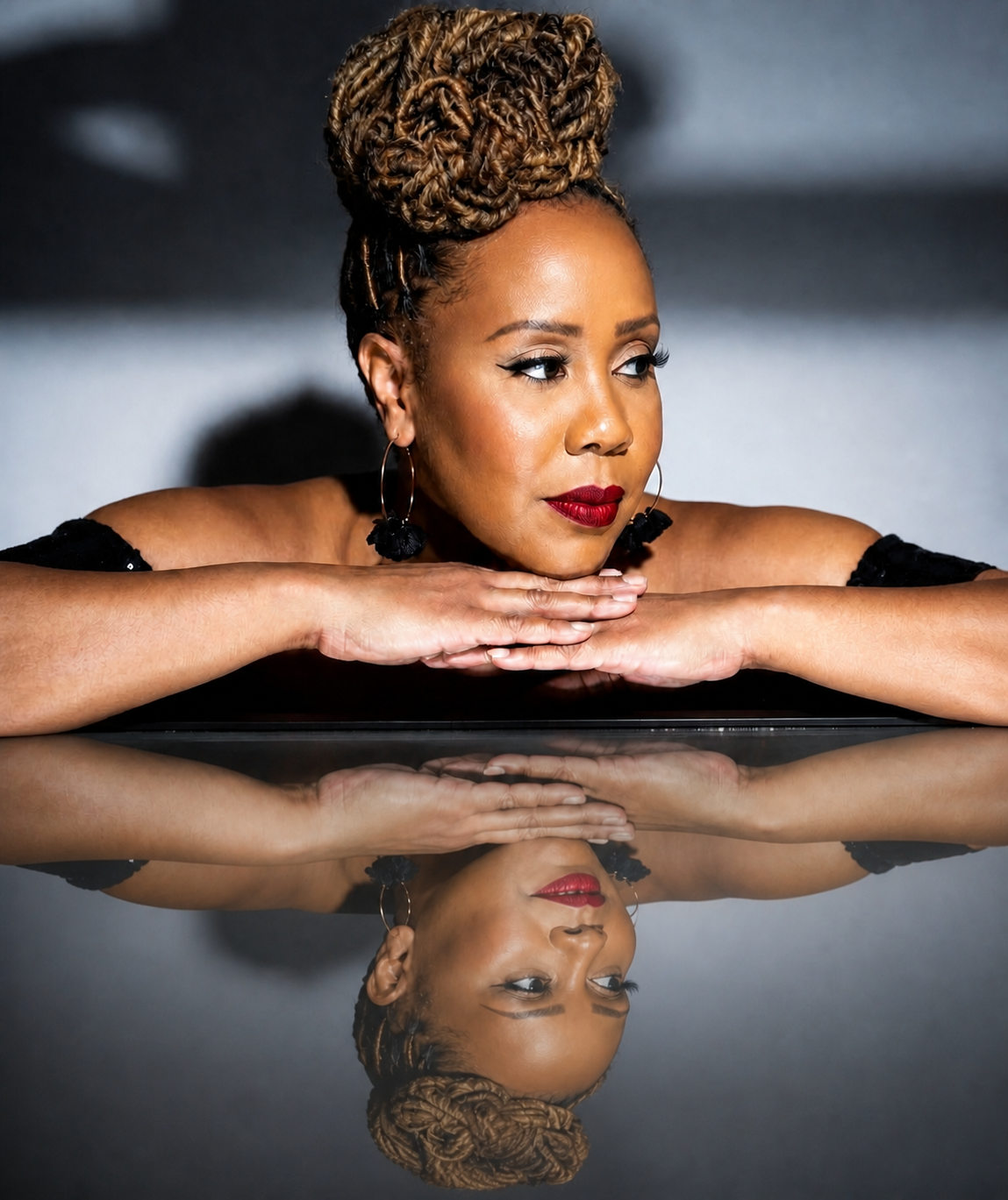 An editorial portrait of Beatrice with her reflection