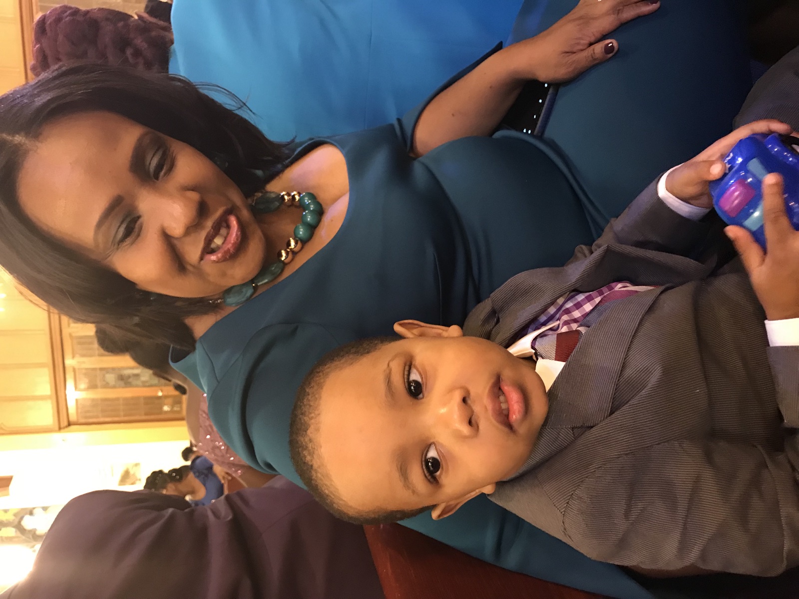 Beatrice sharing a special moment with a young family member